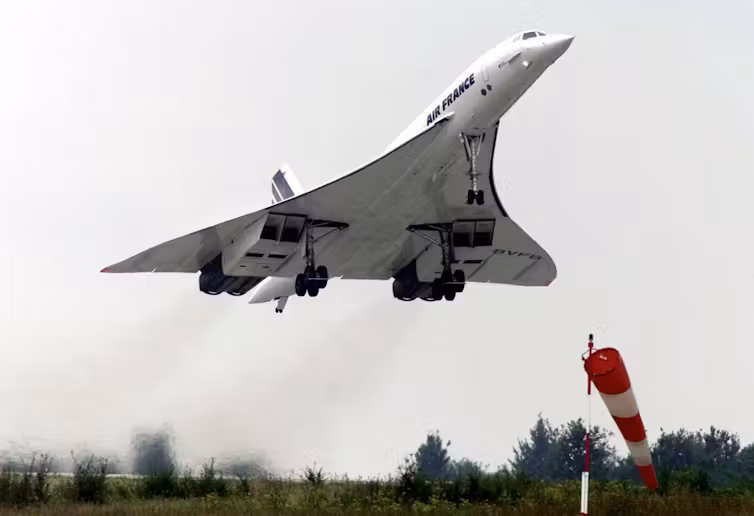 A photo showing a jet with a triangular shape taking off